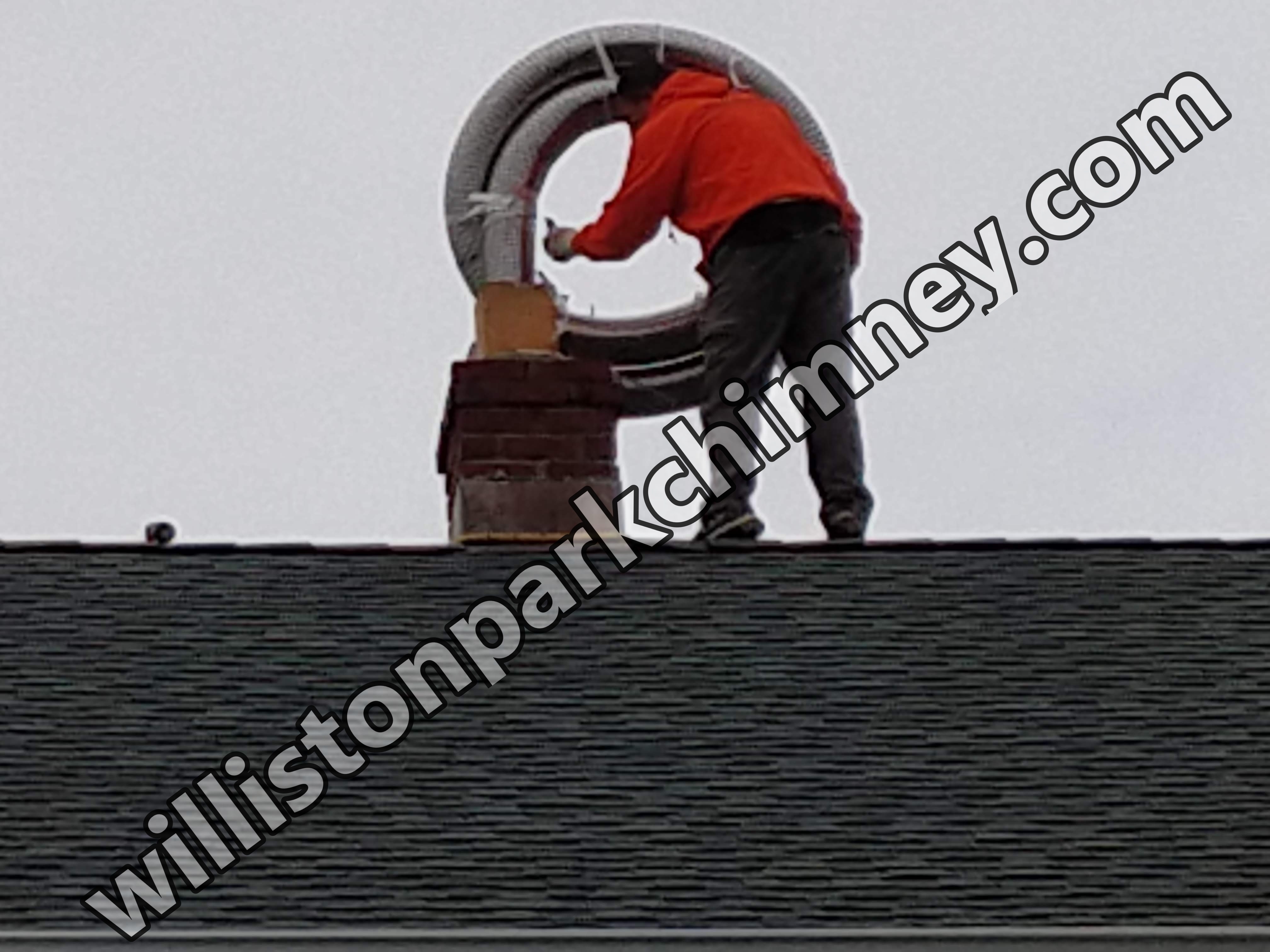 Flexible stainless chimney liner being installed in Williston Park, New York